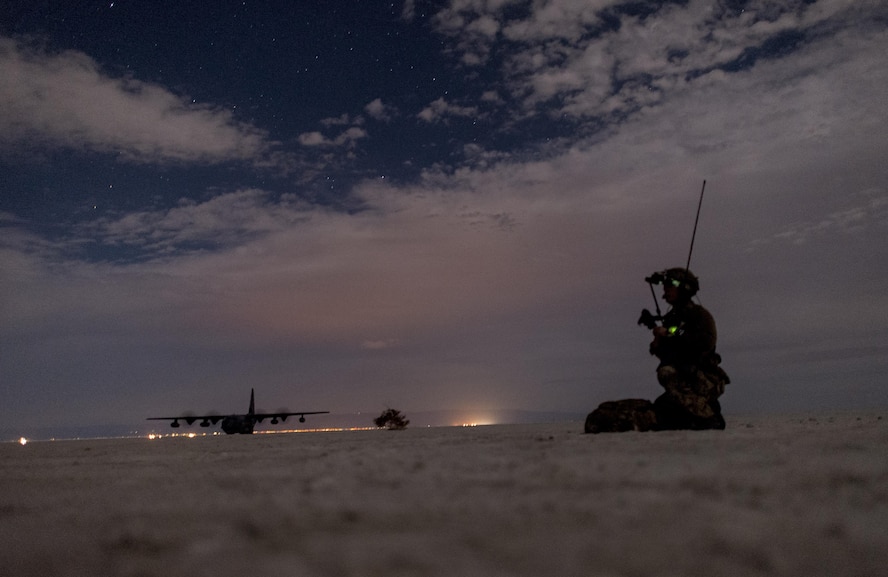 A special Tactics Airman assigned to the 26th Special Tactics Squadron communicate with aircraft in their airspace during a Full Mission Profile exercise at White Sands Missile Range, N.M., Oct. 12, 2016.  The FMP was utilized to integrate special operations forces and foster tactical maturity through deliberate planning and execution of a force projection package and enable Special Tactics Airmen pre-deployment evaluation. (U.S. Air Force photo by Tech. Sgt. Manuel J. Martinez)