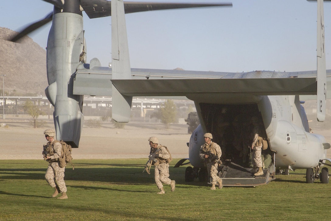 Marines with 2nd Battalion, 3rd Marine Regiment, exit an MV-22 “Osprey” during a Non-combatant Evacuation Operation exercise aboard Marine Corps Air Ground Combat Center, Twentynine Palms, Calif., Oct. 14, 2016. (Official Marine Corps photo by Cpl. Connor Hancock/Released)