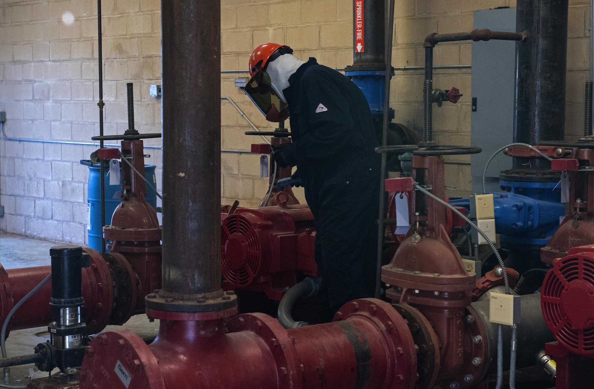 Tim Jacobs, contracted senior inspector, prepares equipment for inspection, Oct. 25, 2016, at Moody Air Force Base, Ga. Jacobs tested the electrical components and gauges on the foam pump system to ensure all readings and outputs were accurate. (U.S. Air Force photo by Airman 1st Class Janiqua P. Robinson)