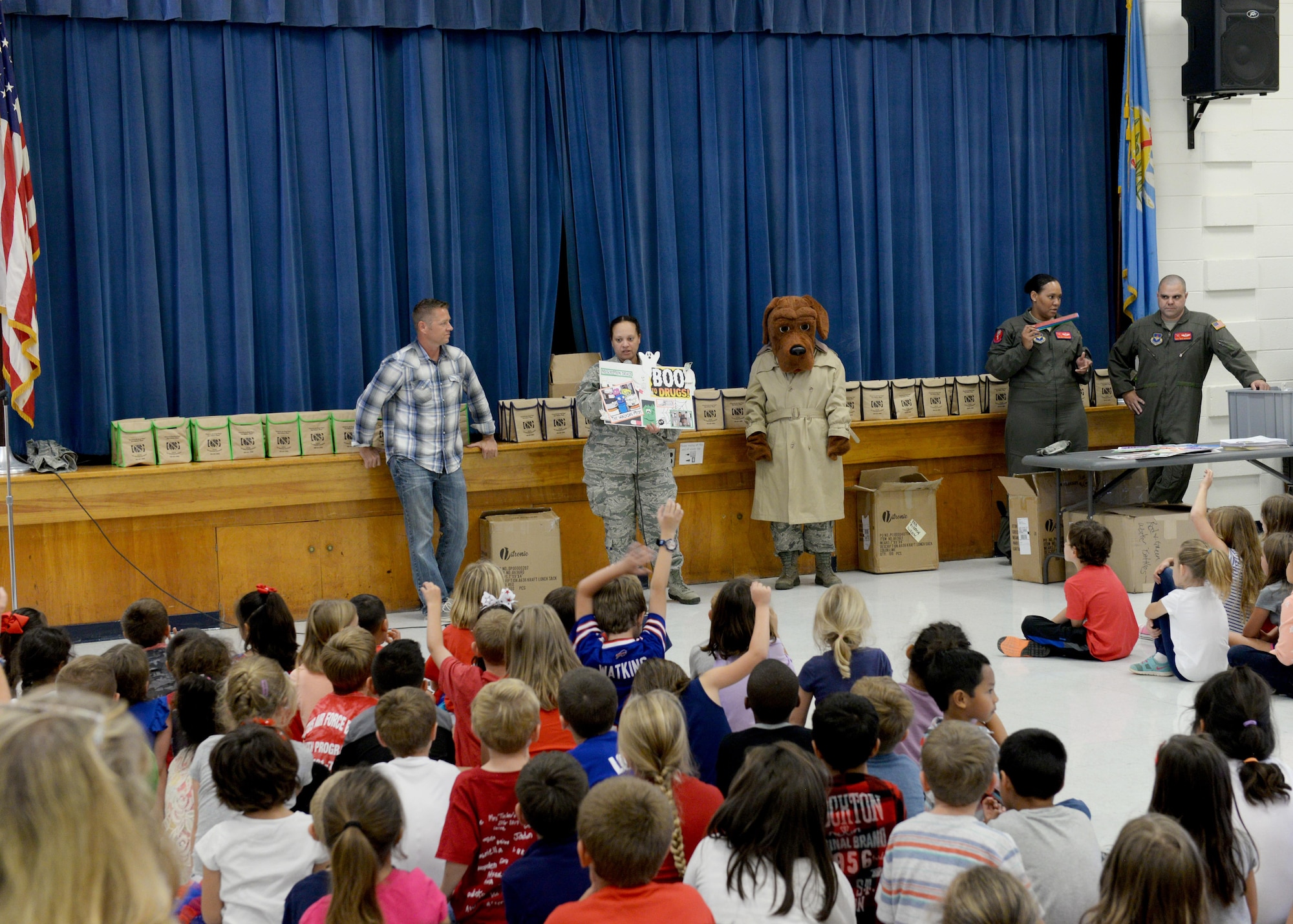 Members of the Altus Air Force Base Drug Demand Reduction Office teach kids at L. Mendel Rivers Elementary School about the dangers of drugs, Oct. 24, 2016, Altus Air Force Base, Okla. DDR is working with the local community to help raise awareness of drug and alcohol abuse. (U.S. Air Force Photo by Airman Jackson N. Haddon/ Released).