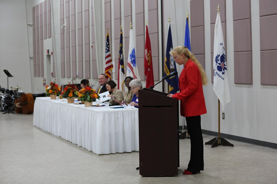 Retired Marine Corps Sgt. Maj. Holly Prafke, co-chair of the 2016 Salute to Women of the Military event, speaks to guests at the Tourist and Event Center in Havelock, N.C., Oct. 20, 2016. In 1987, Bee Mayo and Jean Nelson first discussed the idea of recognizing contributions made by women in the military. Today, that legacy lives on in the Eastern North Carolina area through the Salute to Women of the Military. The event continues to identify women as a vital part of the U.S. Armed Forces. Women from all branches of the military who served in the past or are currently serving came to support the occasion. Mayo is a board member of the Craven County Council on Women, and Nelson is the regional director for the NC Council for Women. (U.S. Marine Corps photo by Lance Cpl. Mackenzie Gibson/Released)