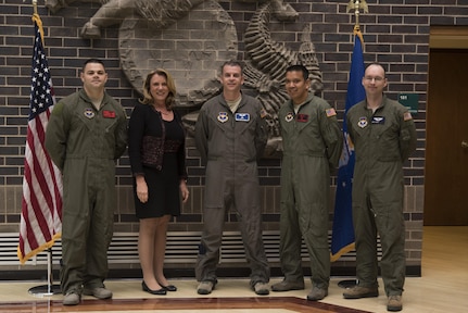 Secretary of the Air Force Deborah Lee James poses with the first four Enlisted Pilot Initial Class students in the U.S. Air Force Initial Flight Training School at Pueblo Memorial Airport in Pueblo, Colorado Oct. 17. The Air Force announced the initiative to integrate the enlisted force into Remotely Piloted Aircraft flying operations as pilots Dec. 17, 2015 starting with the RQ-4 Global Hawk. Name badges were blurred due to Air Force limits on disclosure of identifying information for RPA operators.