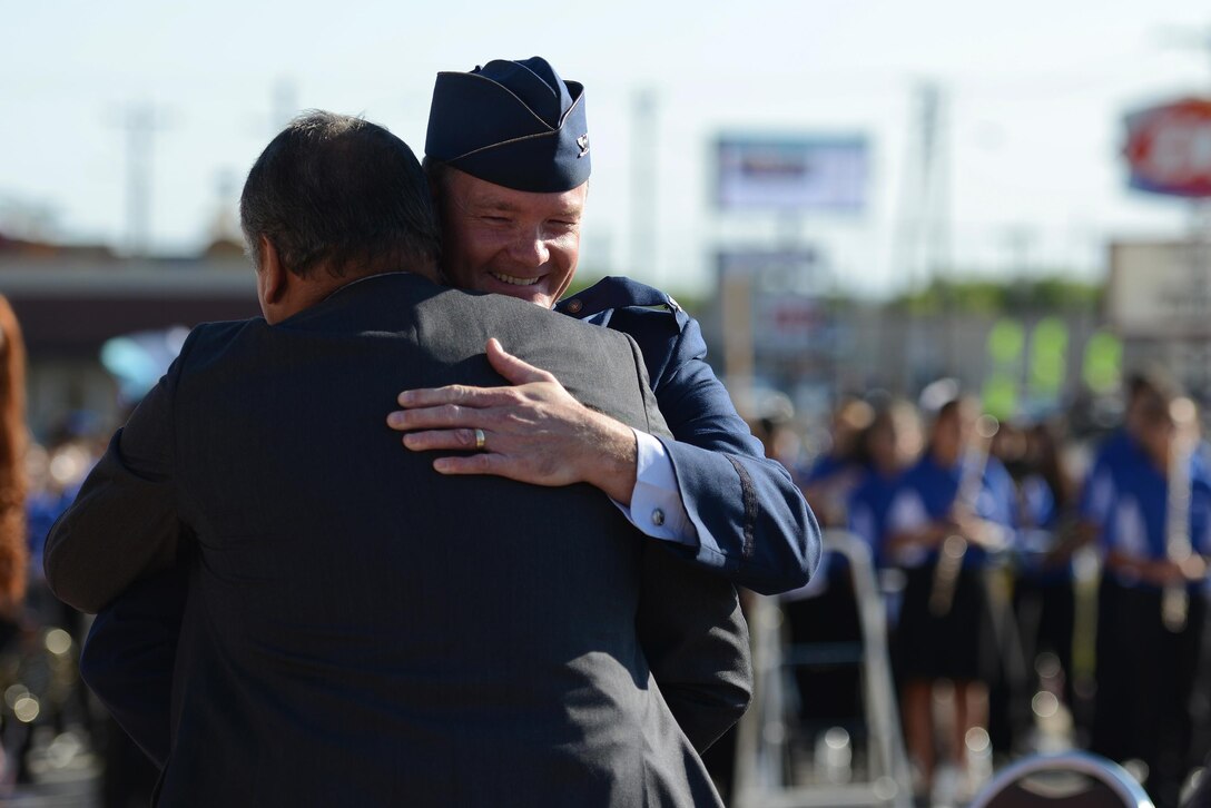 Col. Thomas Shank, 47th Flying Training Wing commander, and Mexican Col. Carlos Flores Pieso embrace at the Convention Center during the Abrazo Ceremony in Del Rio, Texas, on Oct. 21, 2016. The Abrazo, which means to embrace in Spanish, is an annual tradition that symbolizes the friendship between Mexico and the U.S. (U.S. Air Force photo/Senior Airman Ariel D. Partlow)