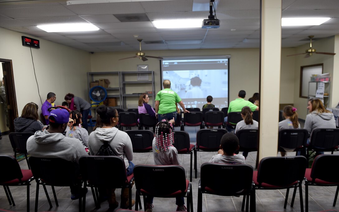 Participants of Operation Dyess Kids 2016 wait in the holding area before processing for their mock deployment at Dyess Air Force Base, Texas, Oct. 22, 2016. More than 200 children participated in the mock deployment to the planet of Naboo. (U.S. Air Force photo by Staff Sgt. Kia Atkins)