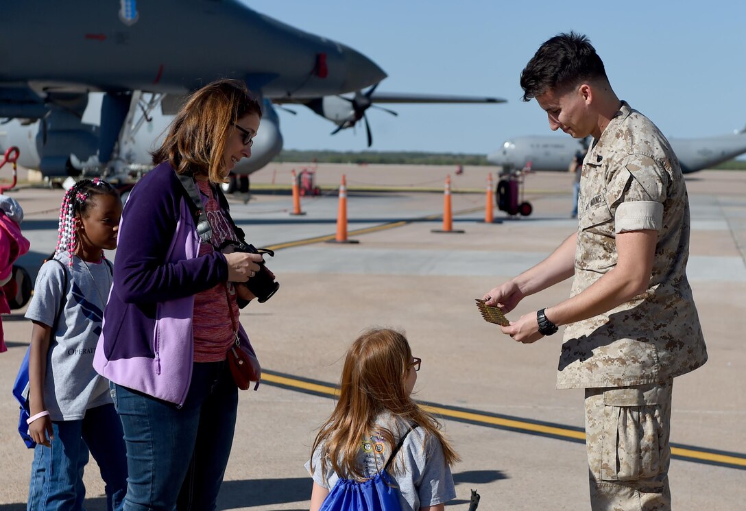 U.S. Marine Cpl. Nicolai Jacobz, Detachment-1, Motor Transport Maintenance Company, shows participants of Operation Dyess Kids 2016 a 7.62x51mm NATO rounds at Dyess Air Force Base, Texas, Oct. 22, 2016. During the children’s mock deployment various units from around Dyess set up static displays to show the children their varying military careers. (U.S. Air Force photo by Staff Sgt. Kia Atkins)