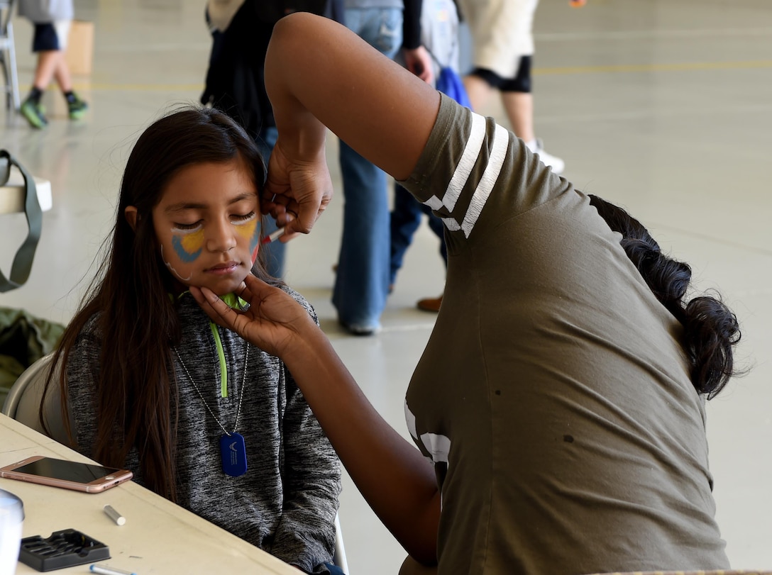 Sky Saucedo gets her face painted during Operation Dyess Kids 2016 at Dyess Air Force Base, Texas, Oct. 22, 2016. The children began their mock deployment by going through a military processing line where they were given dog tags, identification cards and T-shirts. They were then briefed on their upcoming "mission" to the planet Naboo(U.S. Air Force photo by Staff Sgt. Kia Atkins)