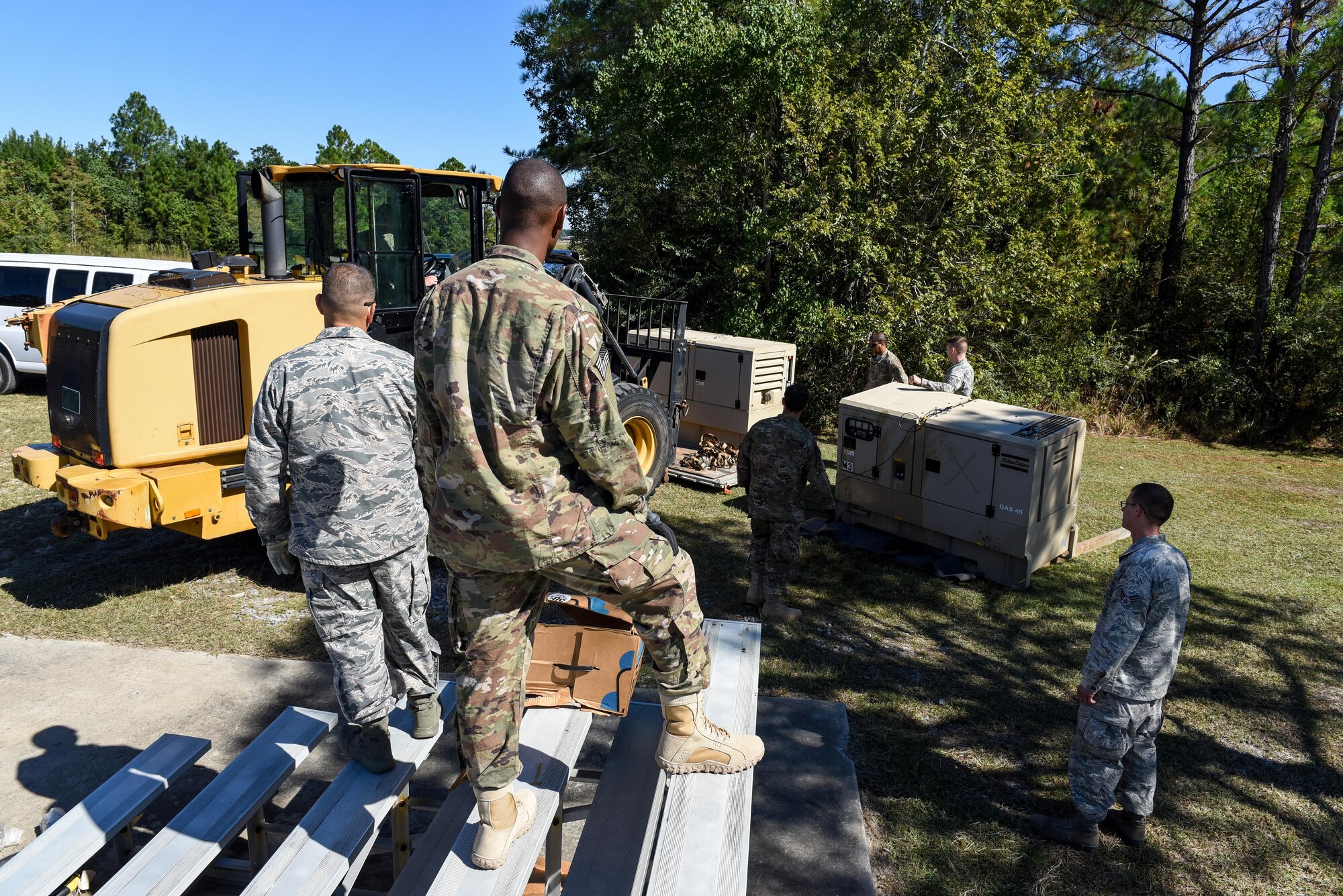 Air Commandos with the 1st Special Operations Civil Engineer Squadron set up generators during the construction of a Joint Special Operations Air Detachment at the Gulfport-Biloxi International Airport in Gulfport, Miss., Oct. 22, 2016. The 1st Special Operations Wing is participating in Exercise Southern Strike to practice tactical skills and test the capabilities of its Airmen and assets in a deployed environment. (U.S. Air Force photo by Senior Airman Jeff Parkinson)
