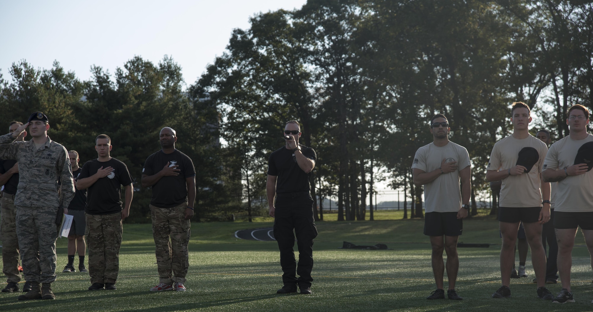 Staff Sgt. Joshua Gilbertson, 11th Security Forces Squadron emergency services team NCO in charge, sings the “Star Spangled Banner” at the opening of the inaugural Battle of the Badges at Joint Base Andrews, Md., Oct. 21, 2016. Battle of the Badges was a competition between JBA’s emergency response units, held to bring the groups together to build camaraderie through friendly competition. (U.S. Air Force photo by Airman 1st Class Rustie Kramer) 
