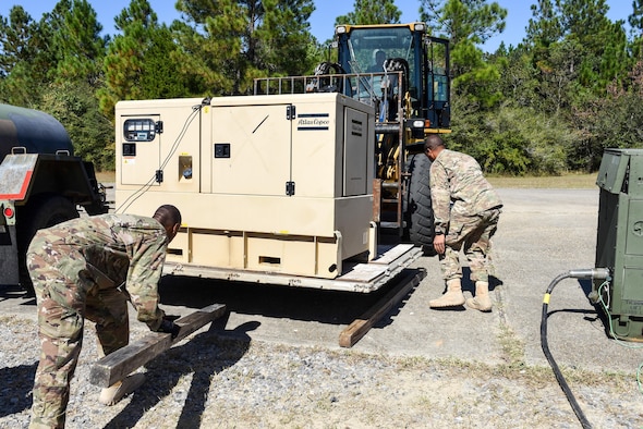 Air Commandos with the 1st Special Operations Civil Engineer Squadron set up generators during the construction of a Joint Special Operations Air Detachment at the Gulfport-Biloxi International Airport in Gulfport, Miss., Oct. 22, 2016. The generators will be used to power the JSOAD during the two-week long Exercise Southern Strike.  (U.S. Air Force photo by Senior Airman Jeff Parkinson)