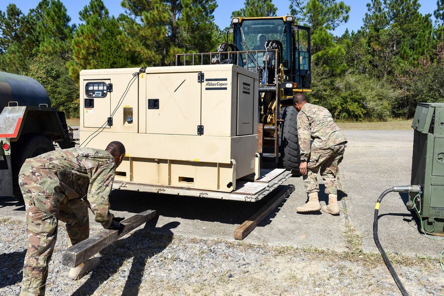 Air Commandos with the 1st Special Operations Civil Engineer Squadron set up generators during the construction of a Joint Special Operations Air Detachment at the Gulfport-Biloxi International Airport in Gulfport, Miss., Oct. 22, 2016. The generators will be used to power the JSOAD during the two-week long Exercise Southern Strike.  (U.S. Air Force photo by Senior Airman Jeff Parkinson)