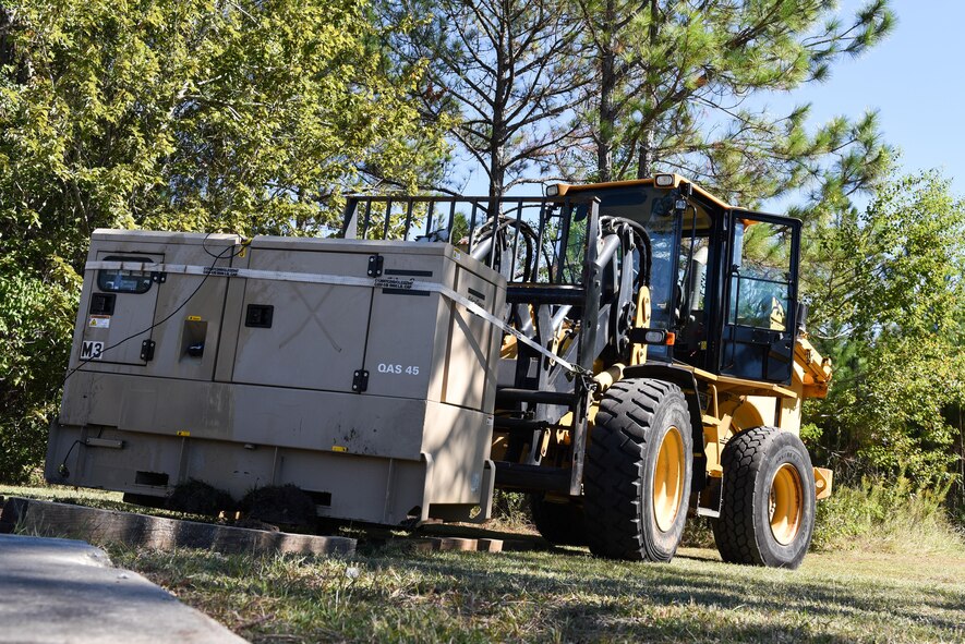 Air Commandos with the 1st Special Operations Civil Engineer Squadron set up generators during the construction of a Joint Special Operations Air Detachment at the Gulfport-Biloxi International Airport in Gulfport, Miss., Oct. 22, 2016. The 1st Special Operations Wing is participating in Exercise Southern Strike to practice tactical skills and test the capabilities of its Airmen and assets in a deployed environment. (U.S. Air Force photo by Senior Airman Jeff Parkinson)