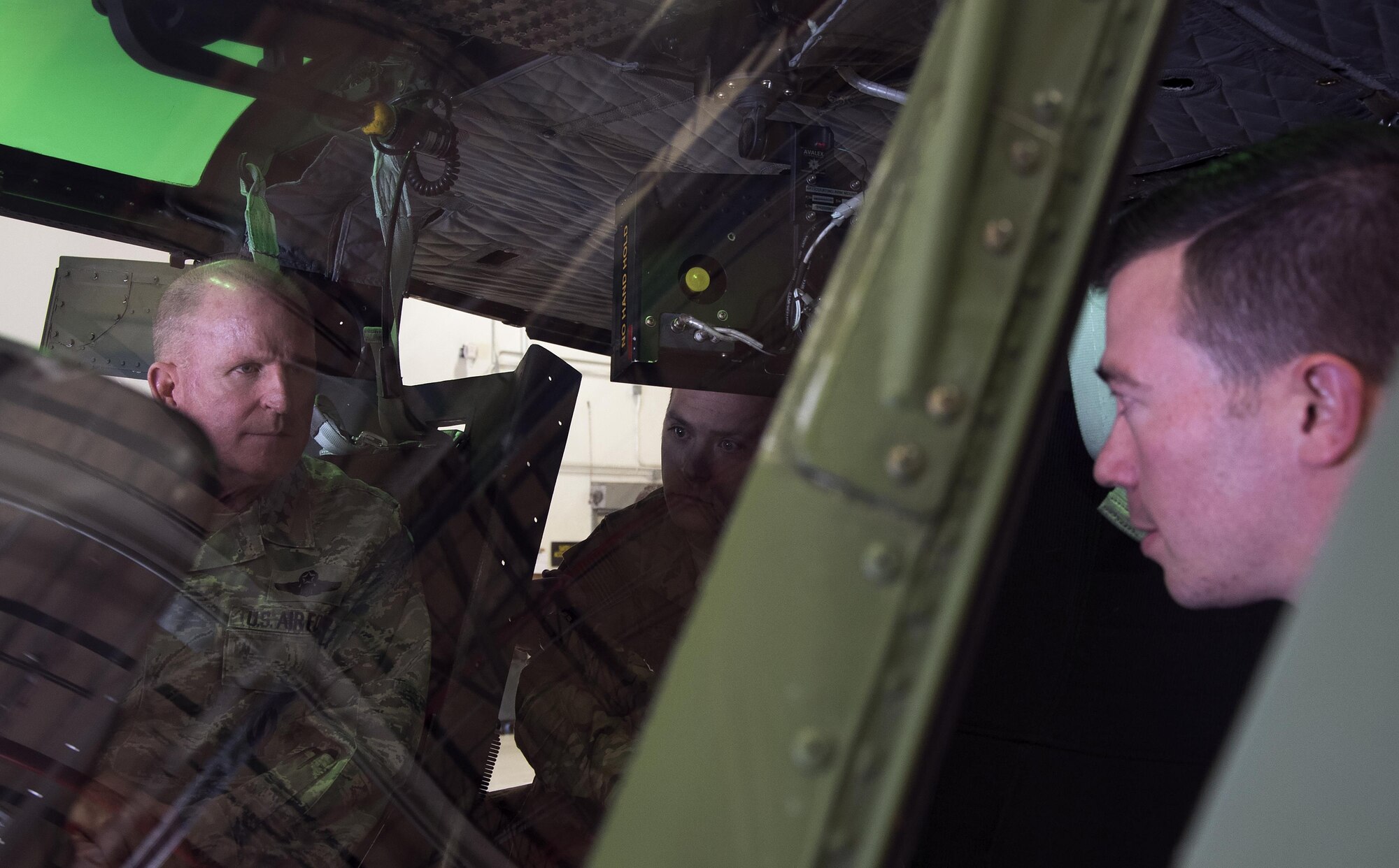 Capt. Josiah Hart, 37th Helicopter Squadron, shows Air Force Vice Chief of Staff Gen. Stephen W. Wilson the recent improvements inside a UH-1N Helicopter on F.E. Warren Air Force Base, Wyo., Oct. 21, 2016. The 582nd Helicopter Group has implemented a number of improvements to execute their security mission. (U.S. Air Force photo by Senior Airman Brandon Valle)