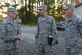 U.S. Air Force Airman 1st Class Alousha Heaney, 633rd Force Support Squadron services journeyman, briefs Maj. Gen. Scott Zobrist, 9th Air Force commander, and Chief Master Sgt. Frank Batten, 9th AF command chief, during a visit at Joint Base Langley-Eusits, Va., Oct. 18, 2016. Heaney showed them a full service single pallet expeditionary kitchen set up for a 633rd Medical Group exercise. (U.S. Air Force photo by Senior Airman Kimberly Nagle)  