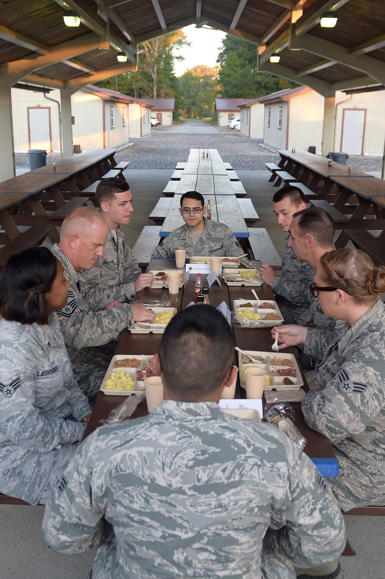 Members of the 633rd Medical Group eat breakfast with U.S. Air Force Maj. Gen. Scott Zobrist, 9th Air Force commander, and Chief Master Sgt. Frank Batten, 9th Air Force command chief, during a visit at Joint Base Langley-Eusits, Va., Oct. 18, 2016. The medical Airmen met with the command team during an exercise at Raptor town with their Expeditionary Medical Support team. (U.S. Air Force photo by Senior Airman Kimberly Nagle)