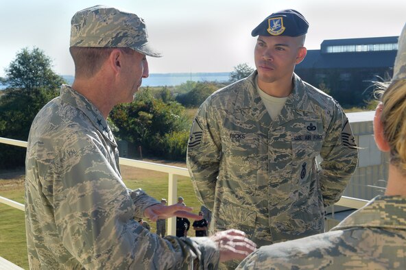 From left, U.S. Air Force Maj. Gen. Scott Zobrist, 9th Air Force commander, speaks with Master Sgt. Christopher Ricks, 633rd Security Forces Squadron NCO in charge of training, during a tour of SFS training facilities at Joint Base Langley-Eusits, Va., Oct. 18, 2016. Zorbist experienced how security forces members train, as well as toured the shooting range while speaking with local law enforcement leadership. (U.S. Air Force photo by Senior Airman Kimberly Nagle)
