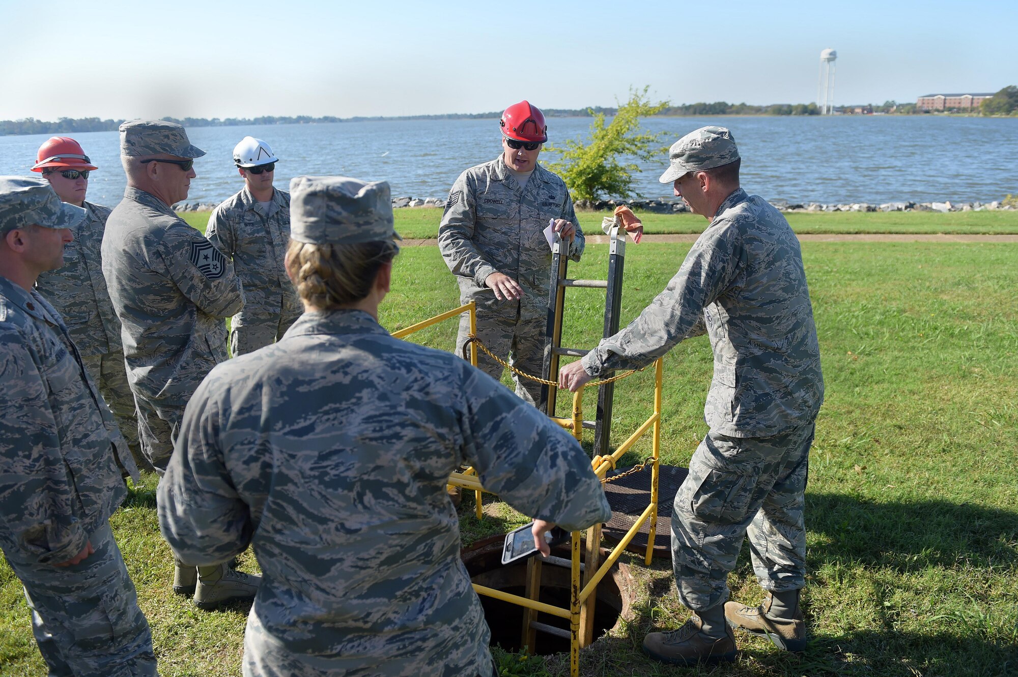 From right, U.S. Air Force Maj. Gen. Scott Zobrist, 9th Air Force commander, receives a briefing on the voice switch by members of the 633rd Communication Squadron at Joint Base Langley-Eustis, Va., Oct. 18, 2016. During their visit with the voice switch members, Zobrist learned hurricane protection protocols and what voice switch members do to assist JBLE. (U.S. Air Force photo by Senior Airman Kimberly Nagle)