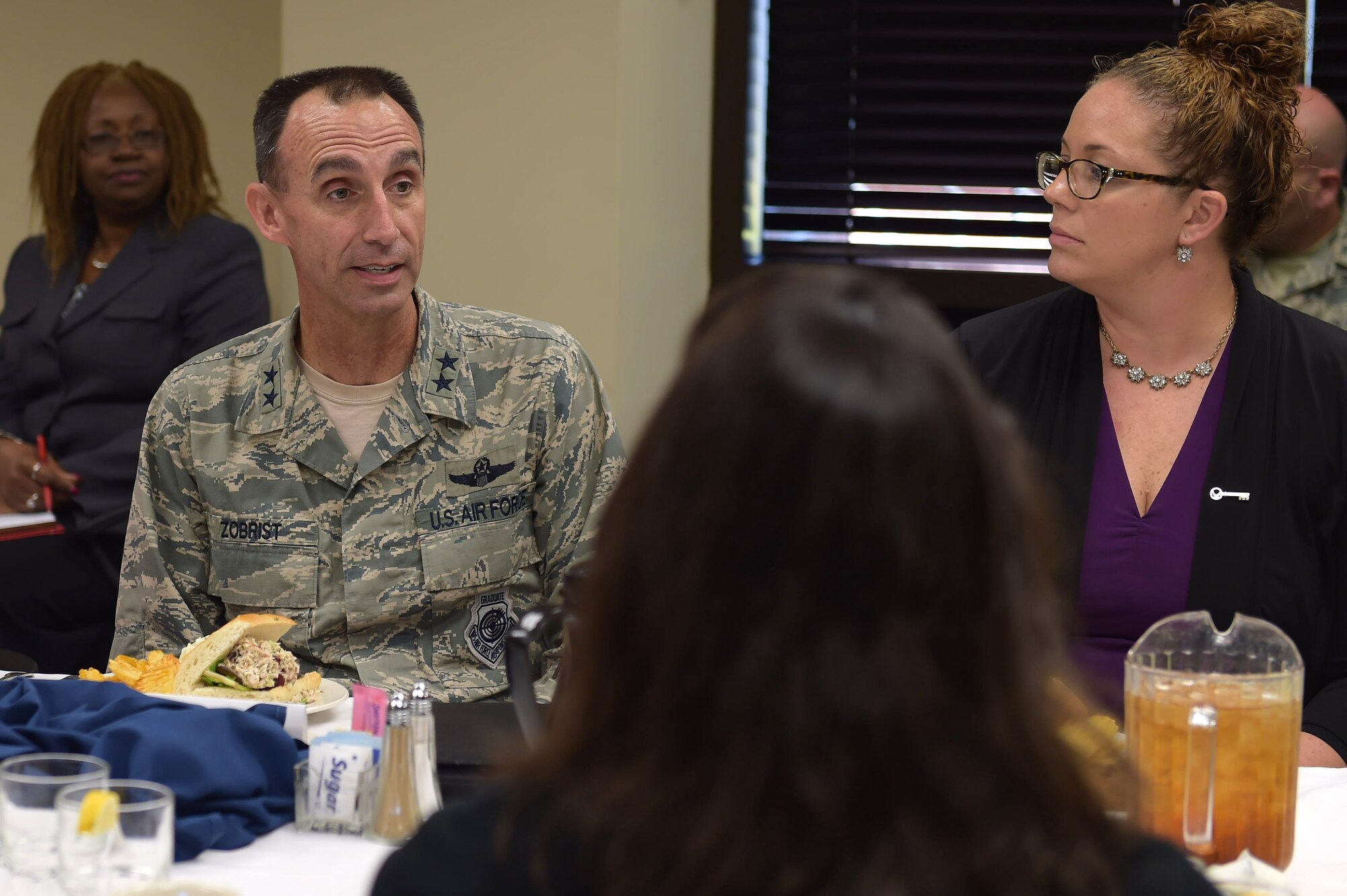 From left, U.S. Air Force Maj. Gen. Scott Zobrist, 9th Air Force commander, eats lunch with 633rd Air Base Wing Key Spouses and first sergeants during a visit at Joint Base Langley-Eustis, Va., Oct. 18, 2016. During their discussion, the crowd discussed Key Spouse socials and other concerns. (U.S. Air Force photo by Senior Airman Kimberly Nagle) 