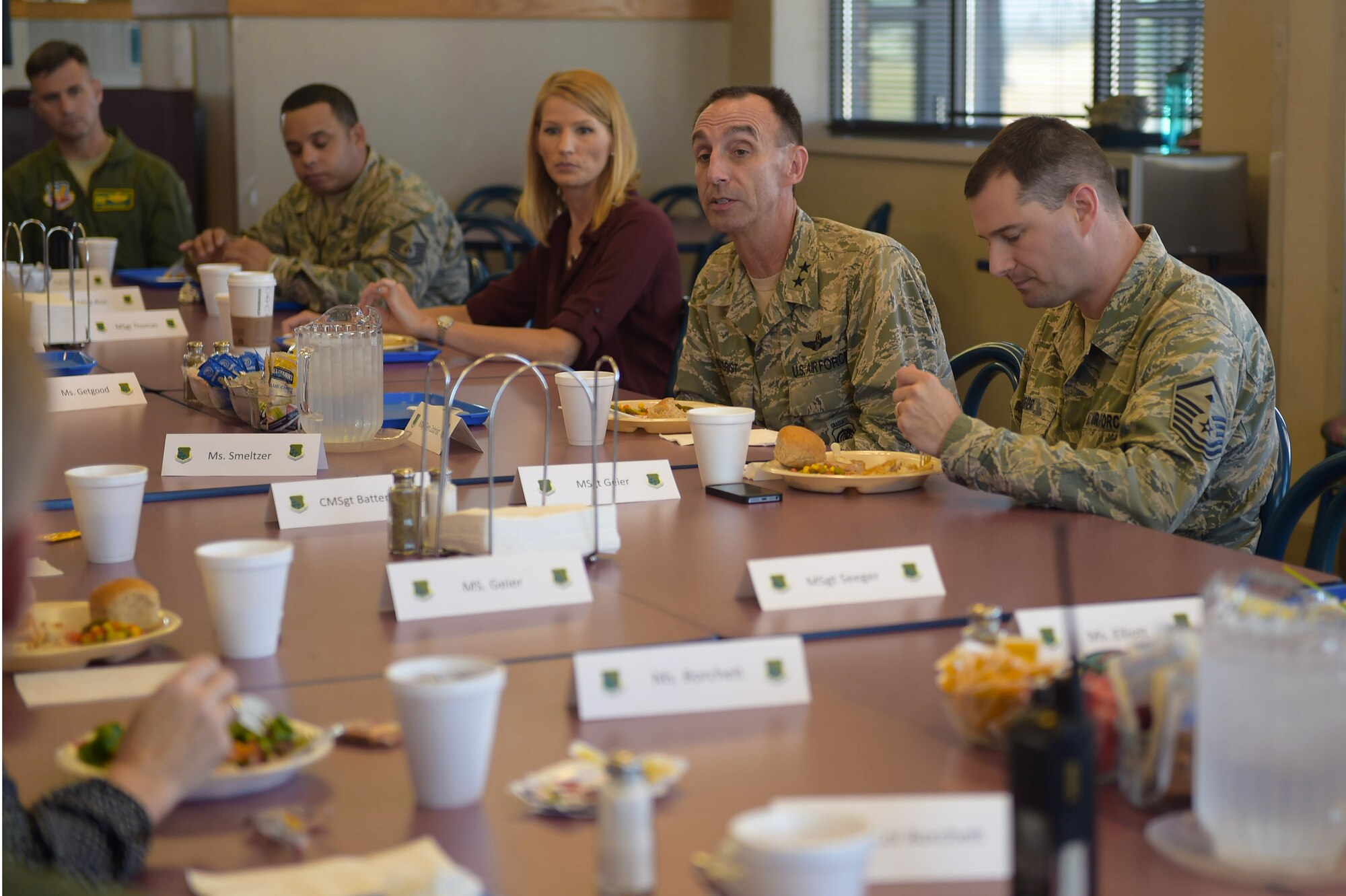 Center, U.S. Air Force Maj. Gen. Scott Zobrist, 9th Air Force commander, speaks with 1st Fighter Wing Key Spouses and first sergeants at Joint Base Langley-Eustis, Va., Oct. 18, 2016. During the luncheon Zobrist discussed ways of having better means of communication for spouses. (U.S. Air Force photo by Senior Airman Kimberly Nagle)