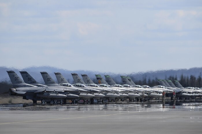 In this file photo, U.S. Air Force F-16 Fighting Falcon aircraft assigned to the 121st Fighter Squadron (FS), Joint Base Andrews, Md., and the 112th FS, Toledo Air National Guard Base, Ohio, stand by for launch May 4, 2015, during RED FLAG-Alaska (RF-A) 15-2 at Eielson Air Force Base, Alaska. RF-A 15-2 enables units from around the globe to conduct live-fire training, utilizing more than 67,000 square miles of airspace over the Joint Pacific Alaska Range Complex. 