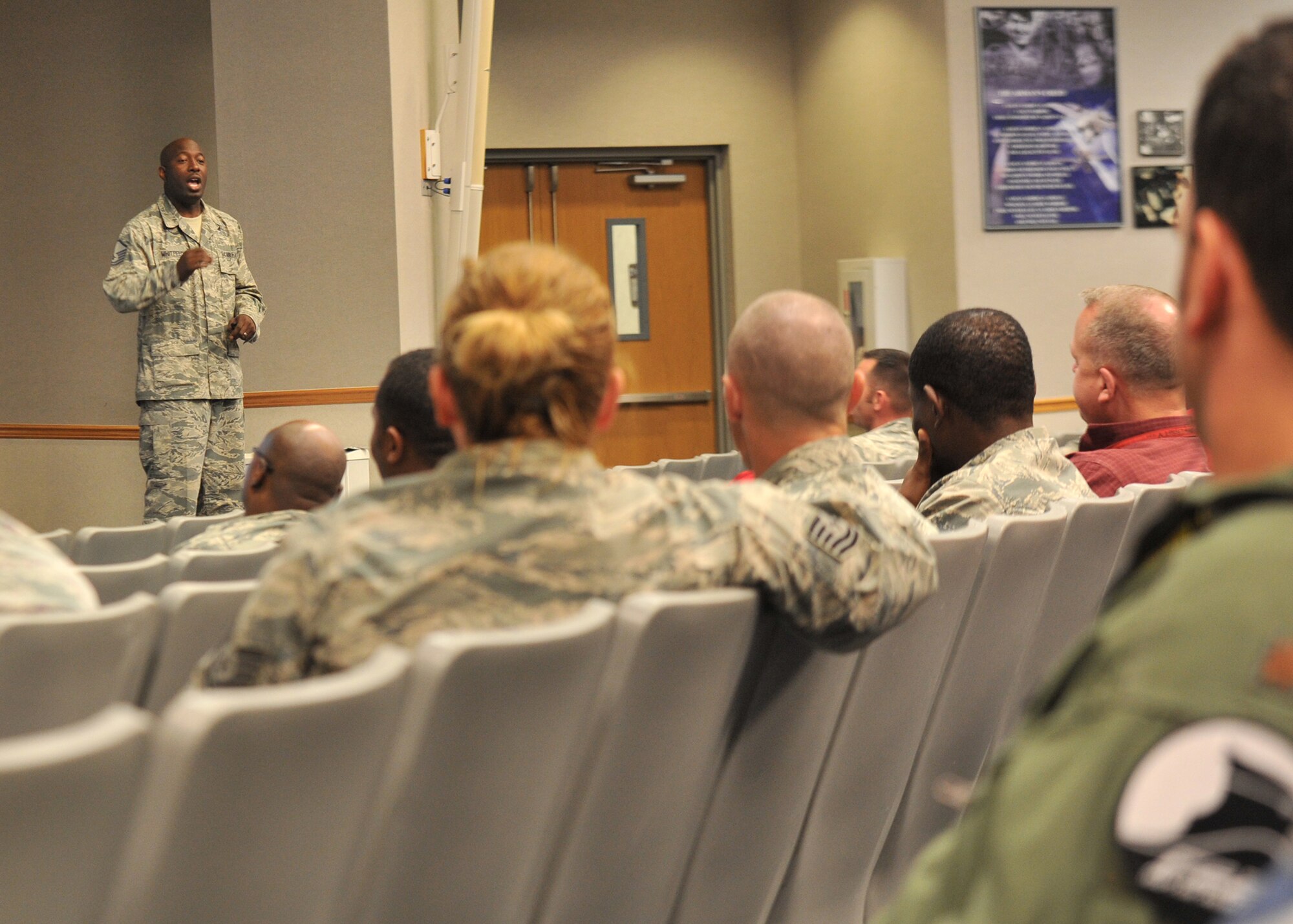 U.S. Air Force Master Sgt. Timothy Whitfield, 325th Maintenance Squadron munitions storage NCO in charge, briefs during a Green Dot training seminar at the 337th Air Control Squadron Dex Rogers Auditorium on Tyndall AFB, Fla., Oct. 20, 2016. The program incorporates both hypothetical and real firsthand violent scenarios that an Airman might encounter, such as sexual assault. (U.S. Air Force photo by Senior Airman Ty-Rico Lea/Released)
