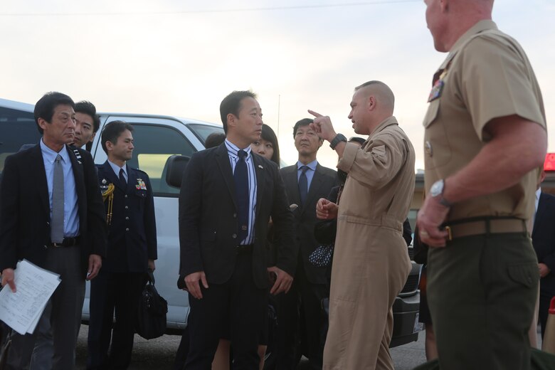 Col. Marcus Annibale, right, commanding officer of Marine Air Group (MAG) 13, welcomes Yoshihiko Fukuda, center, mayor of Iwakuni, Japan, aboard Marine Corps Air Station Yuma, Ariz., Oct. 24. Fukuda visited the air station to speak with Marine Corps aviation officials, observe the capabilities of the F-35B Lightning II and expand his knowledge of the aircraft before Marine Fighter Attack Squadron (VMFA) 121 relocates to MCAS Iwakuni next year. (U.S. Marine Corps photo by Lance Cpl. Harley Robinson/Released)