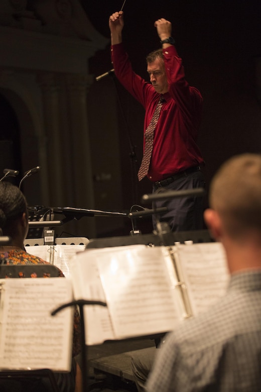 Chief Warrant Officer 3 Michael J. Smith, band officer of Marine Corps Band New Orleans, conducts rehearsal in preparation for his Marines to play at the Ponce La Perla Theater to celebrate Marine Corps Reserve Centennial in Puerto Rico on Oct. 17, 2016.  The Marine Corps Reserve is commemorating 100 years of rich history, heritage, espirit-de-corps, and a bond with Puerto Rico and communities across the U.S. The celebration recognizes the Reserve's essential role as a crisis response force and expeditionary force in readiness, constantly preparing to augment the active component. (U.S. Marine photo by Sgt. Sara Graham/Released)