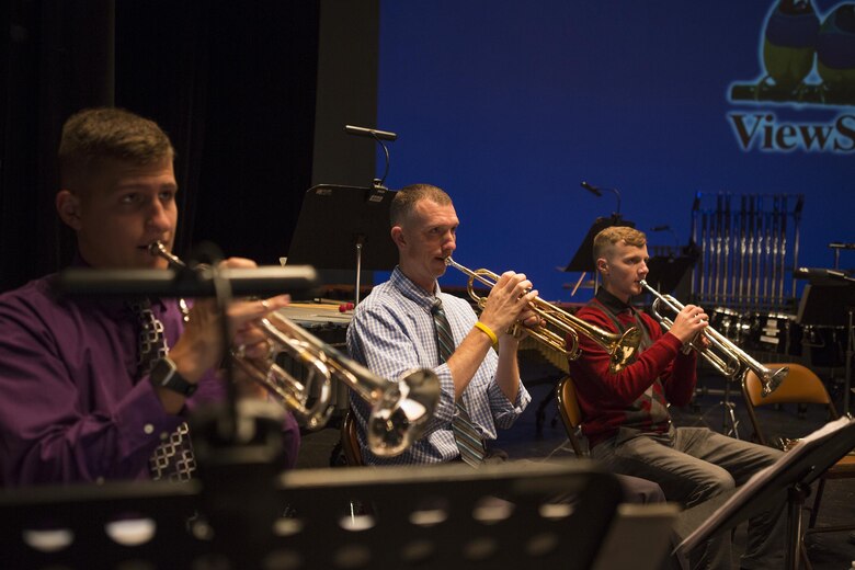 Corporal James Draffen (left), Master Sgt. Timothy Otis (middle), and Lance Cpl. Alex Palmer, musicians with Marine Corps Band New Orleans rehearse at the Ponce La Perla Theater, before playing at a concert to celebrate the Marine Corps Reserve Centennial in Puerto Rico on Oct. 17, 2016. The Marine Corps Reserve is commemorating 100 years of rich history, heritage, espirit-de-corps, and a bond with Puerto Rico and communities across the U.S. The celebration recognizes the Reserve's essential role as a crisis response force and expeditionary force in readiness, constantly preparing to augment the active component. (U.S. Marine photo by Sgt. Sara Graham/Released)