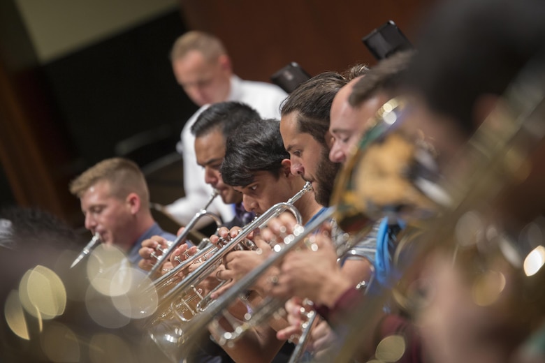 Marines with Marine Corps Band New Orleans join students from the Conservatorio de Musica de Puerto Rico in San Juan to rehearse for the Marine Forces Reserve Centennial Concert Oct. 18, 2016. The Marine Corps Reserve is commemorating 100 years of rich history, heritage, espirit-de-corps, and a bond with Puerto Rico and communities across the U.S. The celebration recognizes the Reserve's essential role as a crisis response force and expeditionary force in readiness, constantly preparing to augment the active component. (U.S. Marine photo by Sgt. Sara Graham/Released)