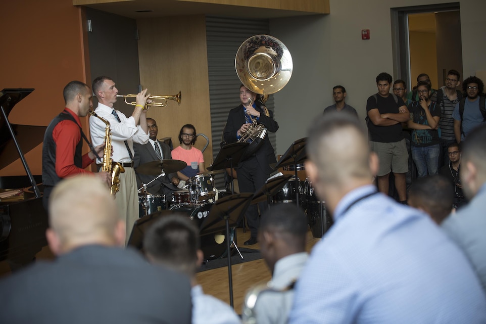 Staff Sgt. Mark A. Pellon (left), 12th Marine Corps district musician placement director, and a guest saxophone player with Marine Corps Band New Orleans, and Master Sgt. Timothy Otis (right), Marine Corps recruiting command head musician procurement, and trumpet player, demonstrate a song while teaching a Master class on music to students attending the Conservatorio de Musica de Puerto Rico in San Juan, before kicking off the Marine Corps Reserve Centennial celebration concert on Oct. 18, 2016. The Marine Corps Reserve is commemorating 100 years of rich history, heritage, espirit-de-corps, and a bond with Puerto Rico and communities across the U.S. The celebration recognizes the Reserve's essential role as a crisis response force and expeditionary force in readiness, constantly preparing to augment the active component. (U.S. Marine photo by Sgt. Sara Graham/Released)