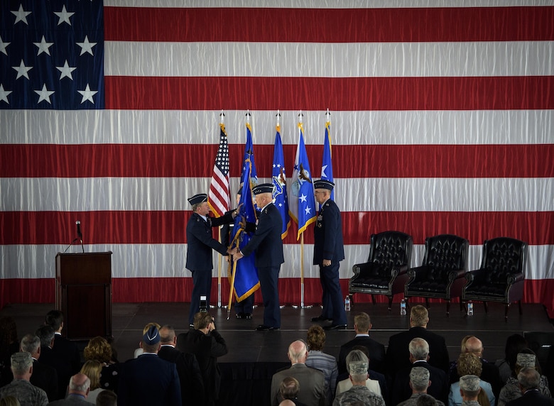 Air Force Chief of Staff Gen. David L. Goldfein passes the Air Force Space Command guidon to Gen. John Raymond Oct. 25, 2016 at Peterson Air Force Base, Colo. Gen. Raymond was previously the Deputy Chief of Staff for Operations, Headquarters Air Force. (U.S. Air Force photo/Tech. Sgt. David Salanitri) 