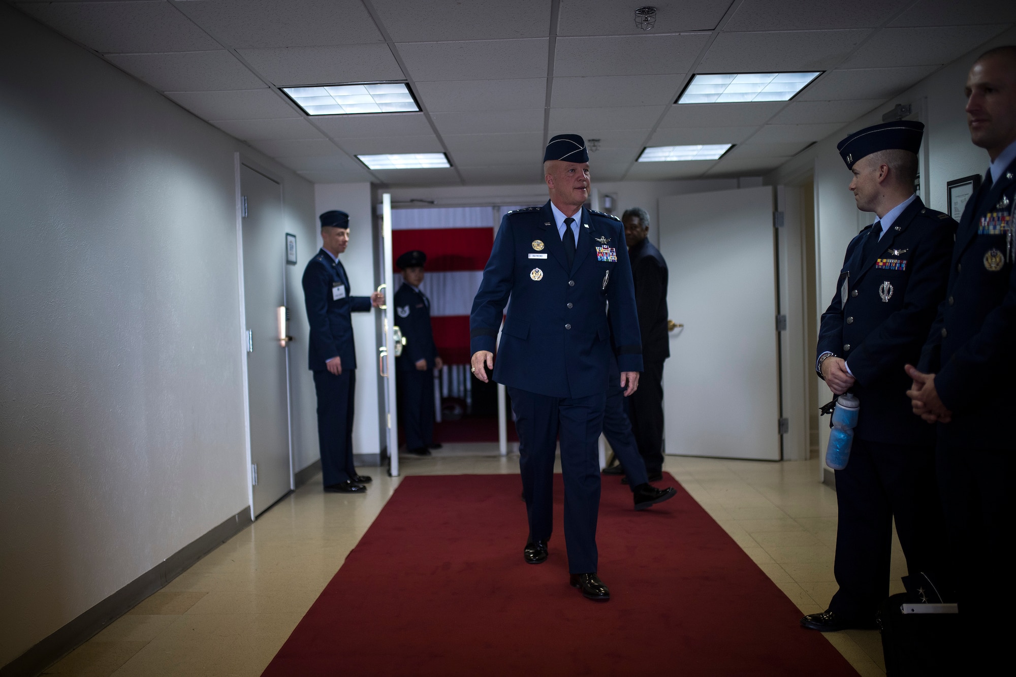Gen. John Raymond prepares to address the media after taking charge of Air Force Space Command from Gen. John Hyten at Peterson Air Force Base, Colo., Oct. 25, 2016. Raymond was previously the Deputy Chief of Staff for Operations, Headquarters Air Force. (U.S. Air Force Photo/Tech. Sgt. David Salanitri)