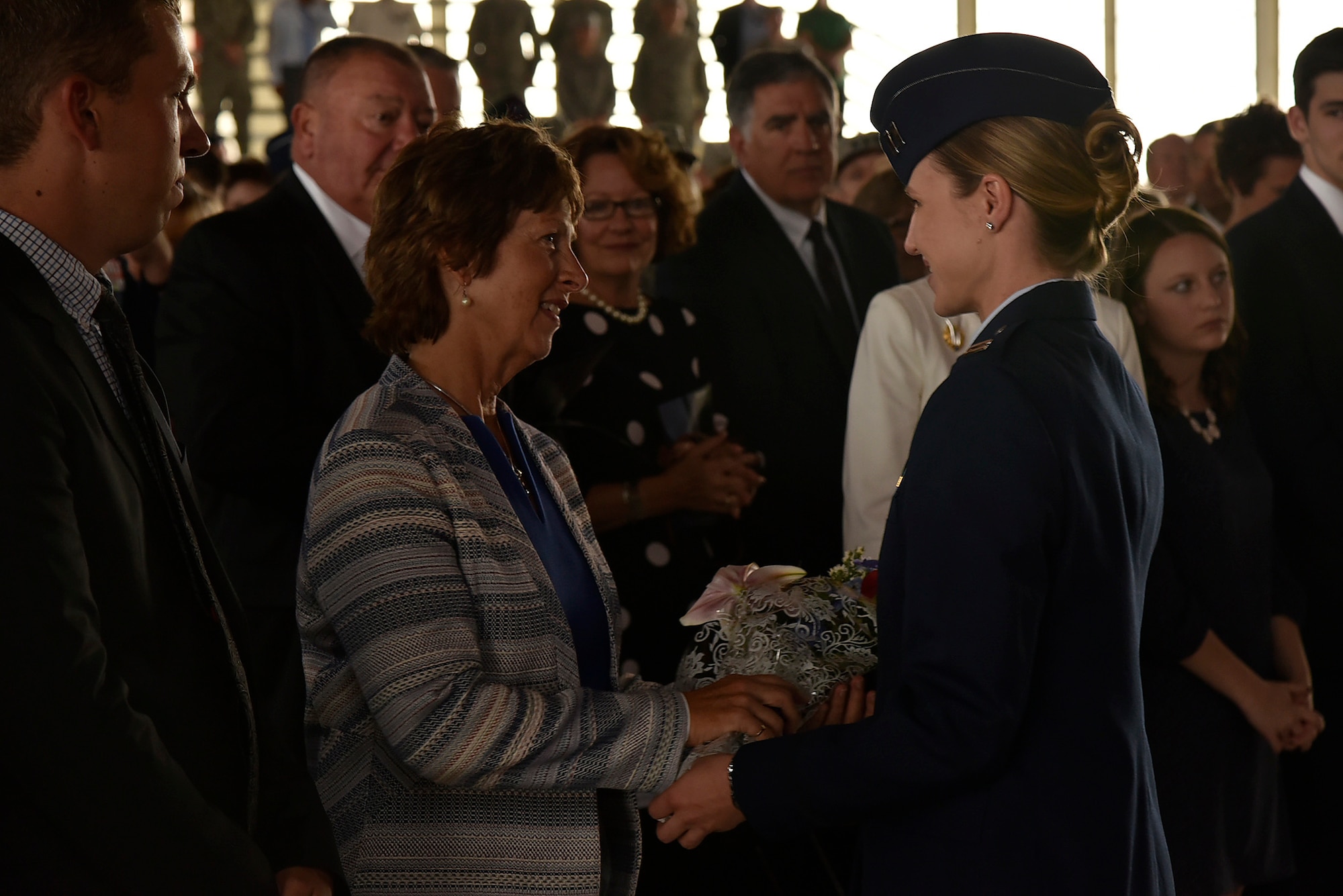 Mrs. Laura Hyten, wife of Gen. John Hyten, receives flowers as a thank you from the Airmen of Air Force Space Command during the AFSPC change of command ceremony Oct. 25, 2016, at Peterson Air Force Base, Colo. The Hytens are moving to Offut Air Force Base, Neb., where the general will become the next commander of U.S. Strategic Command. (U.S. Air Force Photo/Craig Denton)