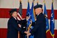 From left, Air Force Chief of Staff Gen. David L. Goldfein passes the guidon of Air Force Space Command to Gen. John Raymond at Peterson Air Force Base, Colo., Oct. 25, 2016. Raymond was previously the Deputy Chief of Staff for Operations, Headquarters Air Force. (U.S. Air Force photo/Craig Denton)