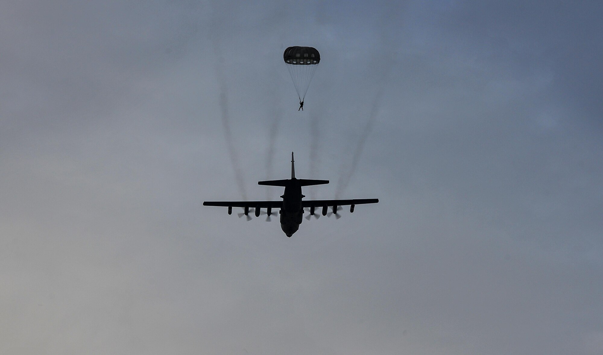 A U.S. Air Force combat controller assigned to the 1st Special Operations Squadron, parachutes out of a U.S. Air Force MC-130H Combat Talon II, assigned to the 353rd Special Operations Group, at Kunsan Air Base, Republic of Korea, Oct. 22, 2016. Members from the 320th Special Tactics Squadron and 1st SOS worked with the ROK 255th Special Operations Squadron to enhance U.S. and ROK Air Force Special Operations Forces' capabilities. They conducted infiltration methods, jump clearing team operations, airfield establishment, aircraft control and close air support familiarization. (U.S. Air Force photo by Senior Airman Colville McFee/Released)