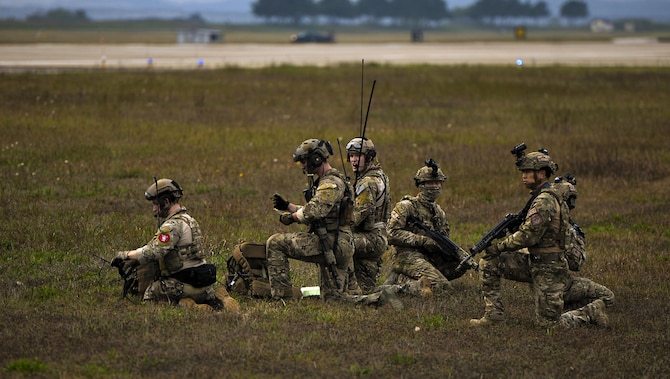 U.S. Air Force combat controllers assigned to the 1st Special Operations Squadron, 320th Special Tactics Squadron and Republic of Korea (ROK) 255th Special Operations Squadron, pull security and establish a line of communication at Kunsan Air Base, Republic of Korea, Oct. 22, 2016. Members from the 320th STS and 1st SOS worked with the ROK 255th SOS to enhance U.S. and ROK Air Force Special Operations Forces' capabilities. They conducted infiltration methods, jump clearing team operations, airfield establishment, aircraft control and close air support familiarization. (U.S. Air Force photo by Senior Airman Colville McFee/Released)