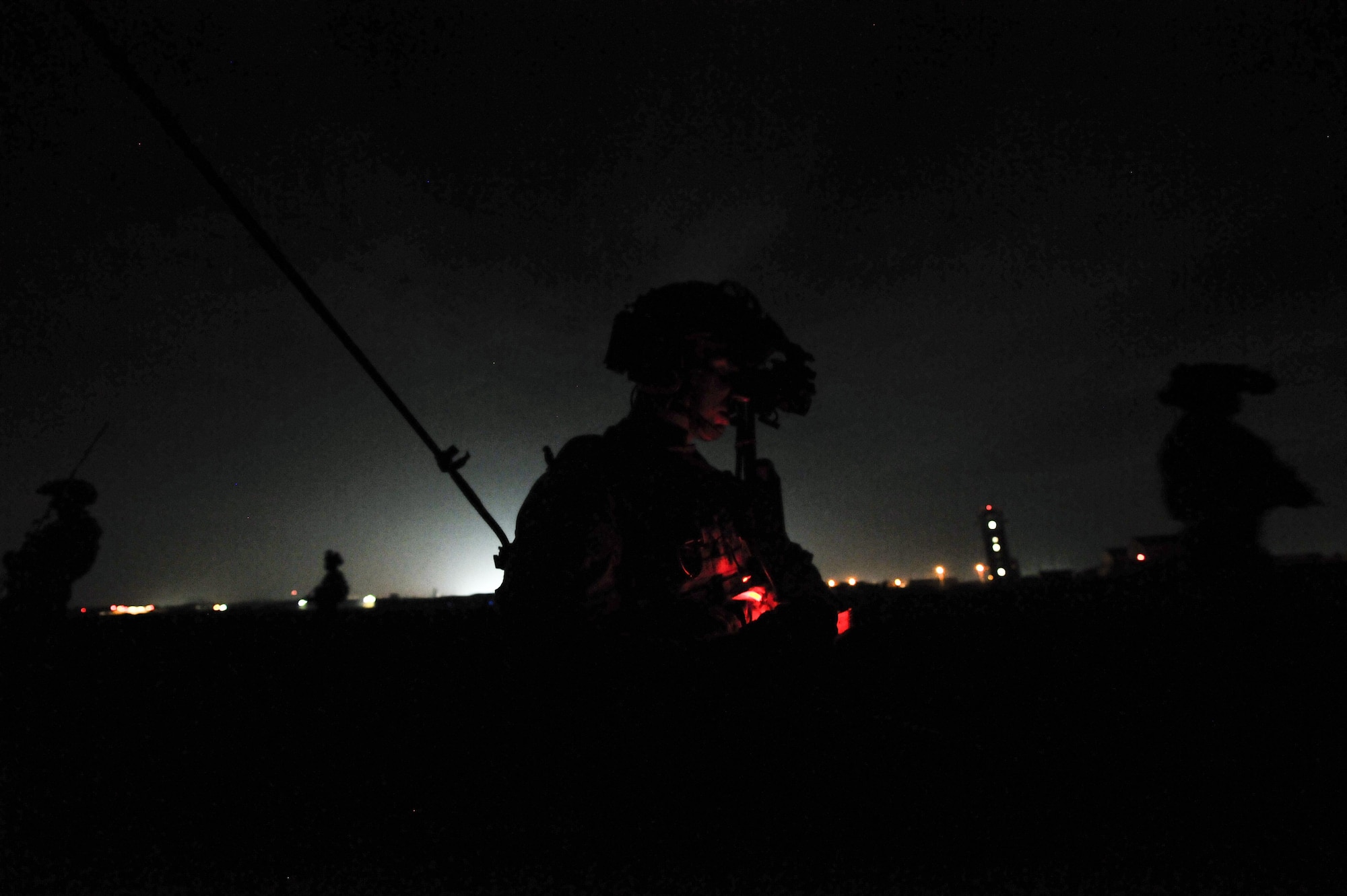 A U.S. Air Force combat controller assigned to the 1st Special Operations Squadron, establishes a line of communication while members from the 320th Special Tactics Squadron and Republic of Korea (ROK) 255th Special Operations Squadron, pull security at Kunsan Air Base, Republic of Korea, Oct. 22, 2016. Members from the 320th STS and 1st SOS worked with the ROK 255th SOS to enhance U.S. and ROK Air Force Special Operations Forces' capabilities. They conducted infiltration methods, jump clearing team operations, airfield establishment, aircraft control and close air support familiarization. (U.S. Air Force photo by Senior Airman Colville McFee/Released)