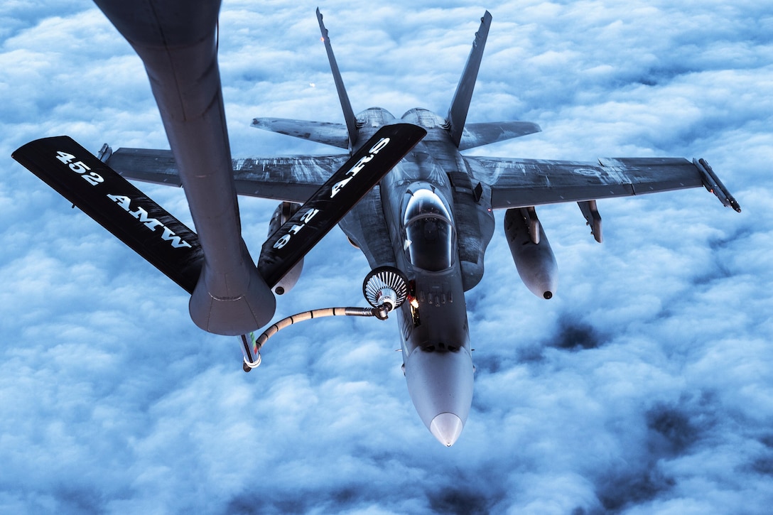 An Air Force KC-135 Stratotanker refuels a Canadian air force CF-18 over Alaska, Oct. 20, 2016, during Vigilant Shield 2017, a training exercise in the high Arctic. Air Force photo by Tech. Sgt. Gregory Brook