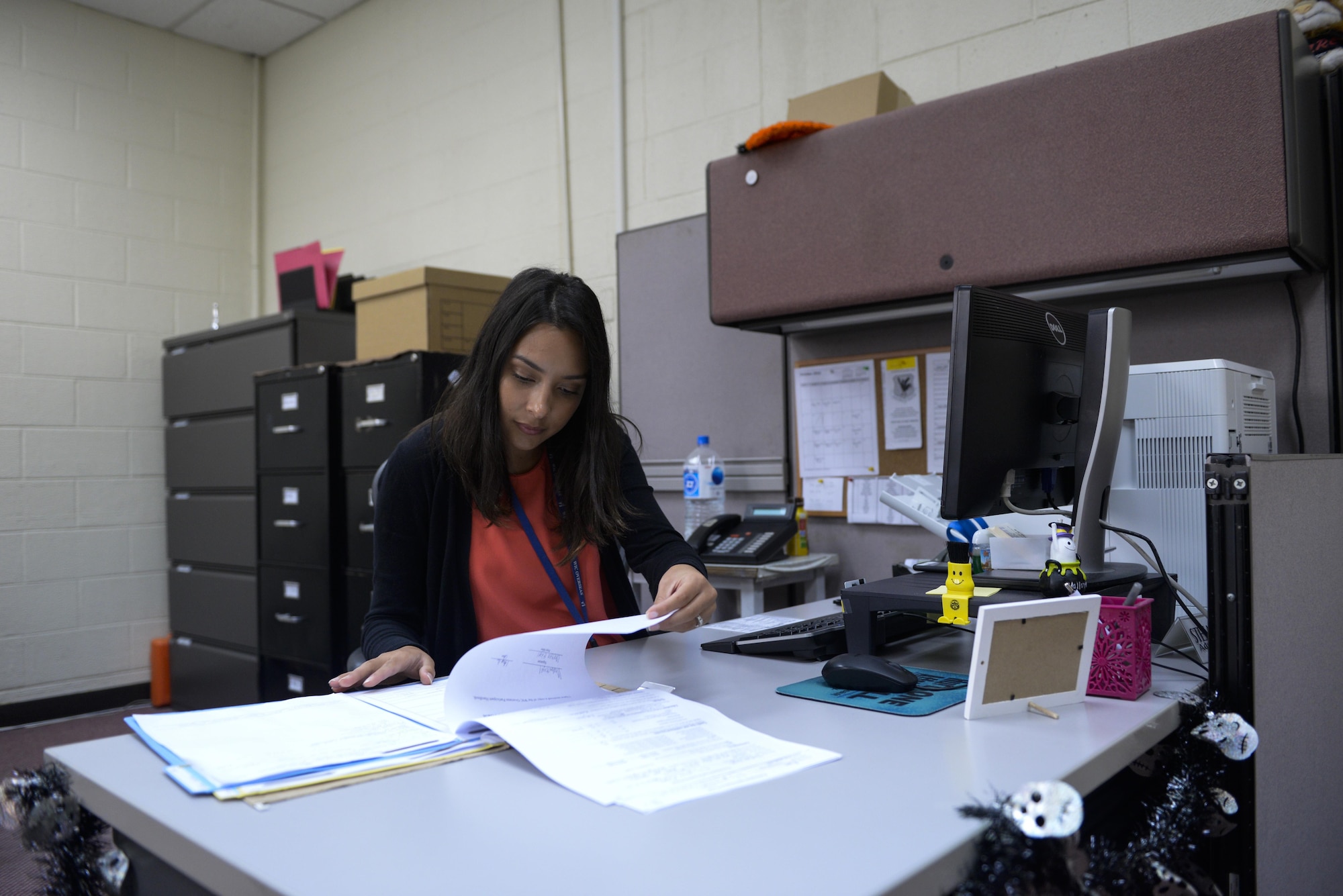 Stefani Carroccia, Kadena Women, Infants and Children’s office administrative assistant, checks documents before an appointment at Kadena Air Base, Japan, Oct. 25, 2016. WIC is a supplemental food and nutrition education program, authorized in 1972 by the Child Nutrition Act, helping young Airmen and their families get the best nutrition options for their families. The program provides eligible participants with supplemental nutritious food, nutrition counseling and education, nutrition-health screening, and referrals to other health agencies. (U.S. Air Force photo by Senior Airman Stephen G. Eigel/Released)