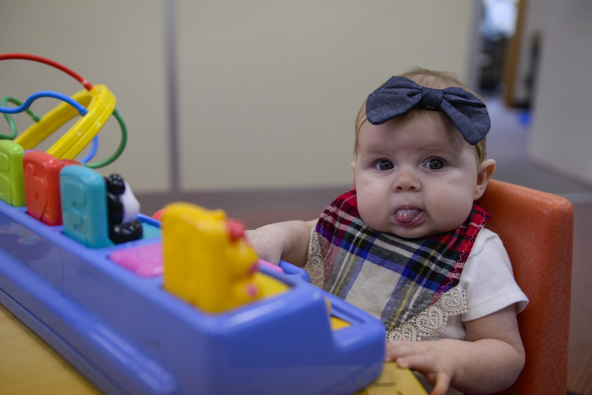 Aspen, a 3-month-old dependent, plays with toys during a Kadena Women, Infants and Children’s office appointment at Kadena Air Base, Japan, Oct. 25, 2016. The Special Supplemental Nutrition Program for WIC is a federal assistance program of the Food and Nutrition Service of the United States Department of Agriculture for healthcare and nutrition of low-income pregnant women, breastfeeding women, and infants and children. Members of the armed forces and their dependents, employees of military departments and their dependents, employees of Department of Defense contractors, and their dependents are typically eligible for the program. (U.S. Air Force photo by Senior Airman Stephen G. Eigel/Released)