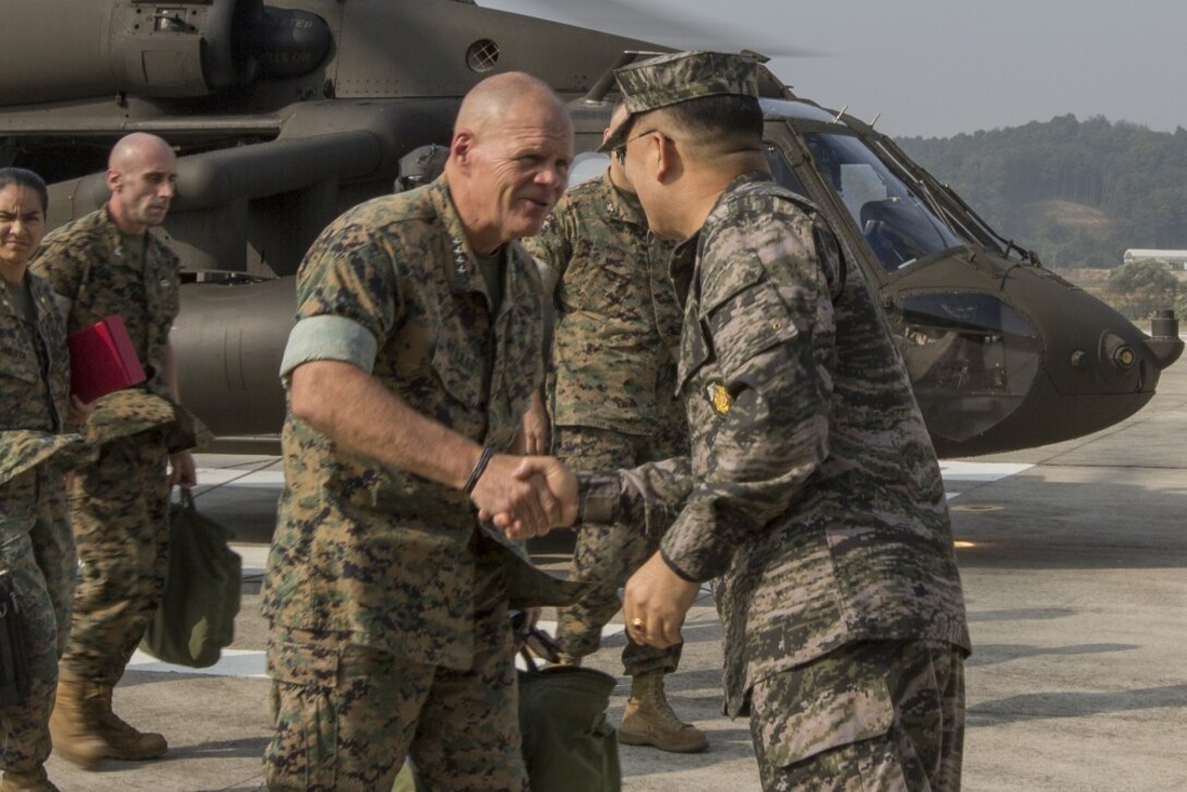 Commandant of the Marine Corps Gen. Robert B. Neller, left, shakes hands with Republic of Korea (ROK) Marine Corps Lt. Gen. Sang-Hoon Lee, commandant of the ROK Marine Corps, in Baran, South Korea, Oct. 15, 2016. Neller visited Baran to meet with ROK Marine Corps leadership. (U.S. Marine Corps photo by Cpl. Samantha K. Braun) 