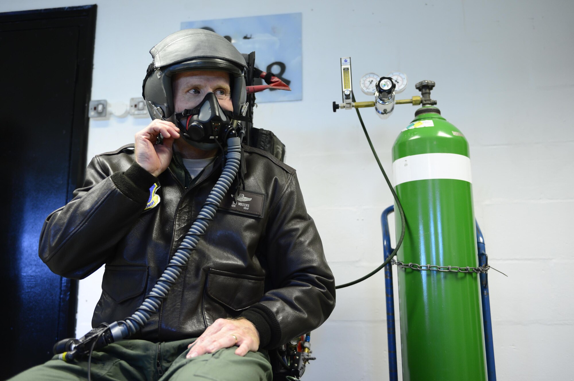 Gen. Tod Wolters, U.S. Air Forces in Europe and Air Forces Africa commander, experiences the aircrew emergency oxygen simulator at the 48th Component Maintenance Squadron during his visit to Royal Air Force Lakenheath, England, Oct. 25. The simulator provides aircraft operators a controlled and realistic experience of an emergency oxygen system activation. (U.S. Air Force photo by Senior Airman Malcolm Mayfield)