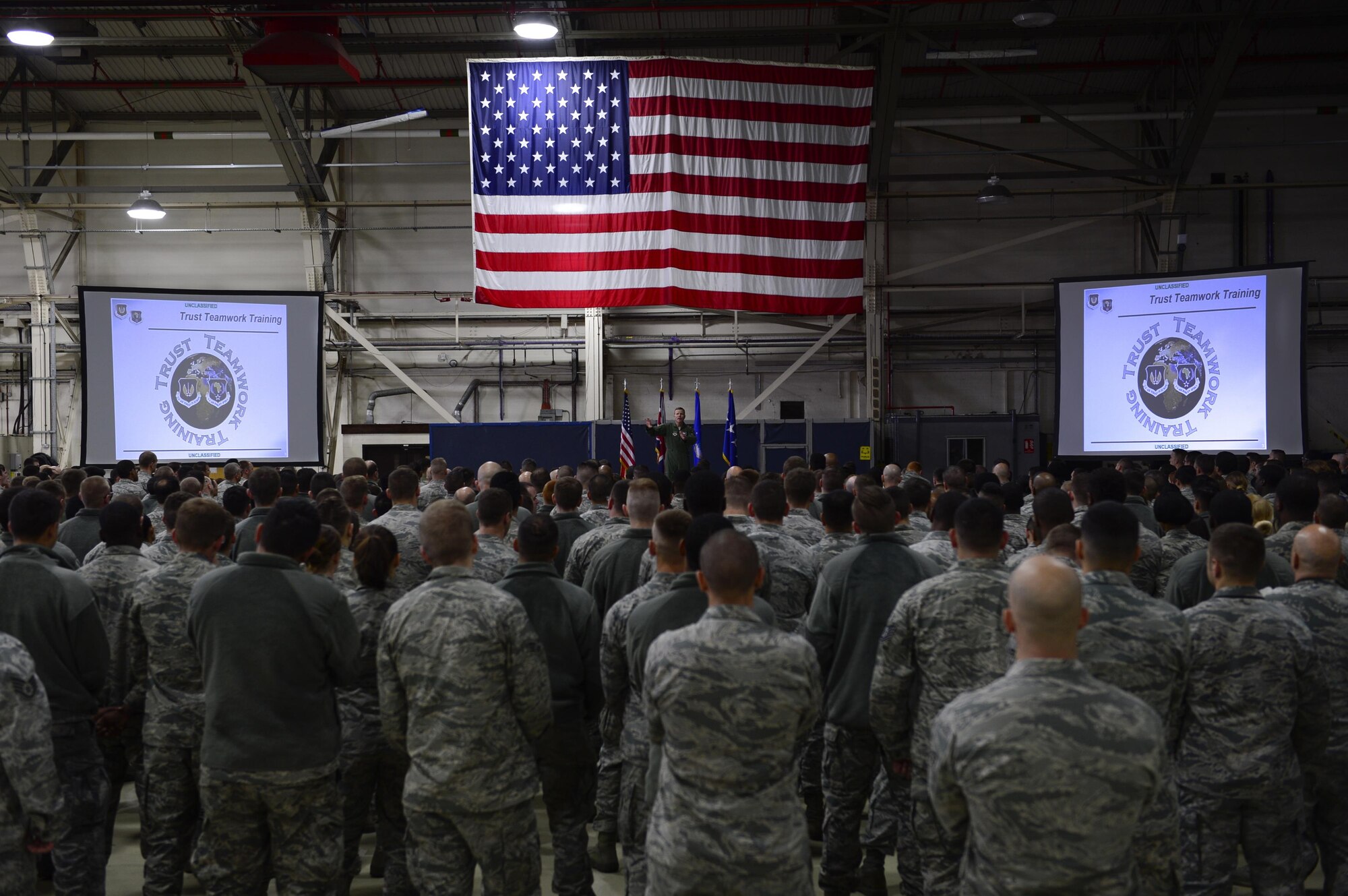U.S. Air Force Airmen listen to Gen. Tod Wolters, U.S. Air Forces in Europe and Air Forces Africa commander, during an all-call inside Hangar 7 at Royal Air Force Lakenheath, England, Oct. 25. Hundreds of Airmen from RAF Lakenheath attended the all-call, where Wolters shared his priorities and thanked Airmen for their service. (U.S. Air Force photo by Senior Airman Malcolm Mayfield)