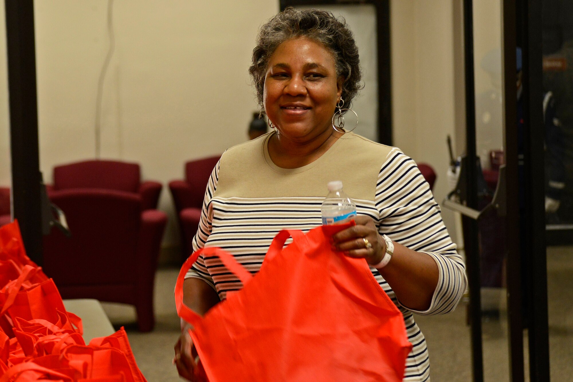 Laverne Cauthen, 20th Force Support Squadron food service worker, receives a gift bag filled with complimentary items at Team Shaw’s Annual AbilityOne Picnic on Shaw Air Force Base, S.C., Oct. 21, 2016. AbilityOne is a program that has helped people with disabilities obtain jobs since 2007. (U.S. Air Force photo by Airman 1st Class BrieAnna Stillman)