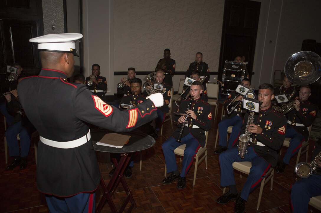 Gunnery Sgt. Justin Hauser, enlisted conductor of Marine Corps Band New Orleans, conducts the band while attending Detachment 1, Landing Support Company, Combat Logistics Regiment 45, 4th Marine Logistics Group’s 241st Marine Corps Birthday Ball celebration in Rio Grande, Puerto Rico, Oct. 22, 2016. The Reserve Marines are celebrating the 241st birthday as well as the Marine Corps Reserve Centennial anniversary. For the past week they have joined Marine Corps Band New Orleans to commemorate 100 years of rich history, heritage, espirit-de-corps, and a bond with not only Puerto Rico but with communities across the U.S. (U.S. Marine photo by Sgt. Sara Graham/Released)