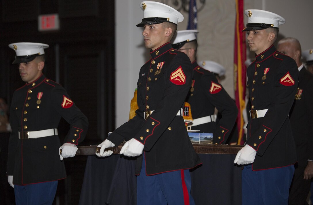 Marines with Landing Support Company, Combat Logistics Regiment 45, 4th Marine Logistics Group, escort the birthday cake during their 241st Marine Corps Birthday Ball celebration in Rio Grande, Puerto Rico, Oct. 22, 2016. The Reserve Marines are celebrating the 241st birthday as well as the Marine Corps Reserve Centennial anniversary. For the past week they have joined Marine Corps Band New Orleans to commemorate 100 years of rich history, heritage, espirit-de-corps, and a bond with not only Puerto Rico but with communities across the U.S. (U.S. Marine photo by Sgt. Sara Graham/Released)