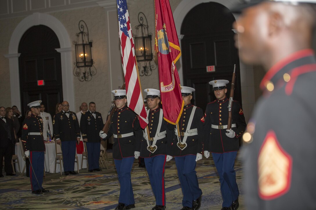 Marines with Landing Support Company, Combat Logistics Regiment 45, 4th Marine Logistics Group, march on the colors during their 241st Marine Corps Birthday Ball celebration in Rio Grande, Puerto Rico, Oct. 22, 2016. The Reserve Marines are celebrating the 241st birthday as well as the Marine Corps Reserve Centennial anniversary. For the past week they have joined Marine Corps Band New Orleans to commemorate 100 years of rich history, heritage, espirit-de-corps, and a bond with not only Puerto Rico but with communities across the U.S. (U.S. Marine photo by Sgt. Sara Graham/Released)