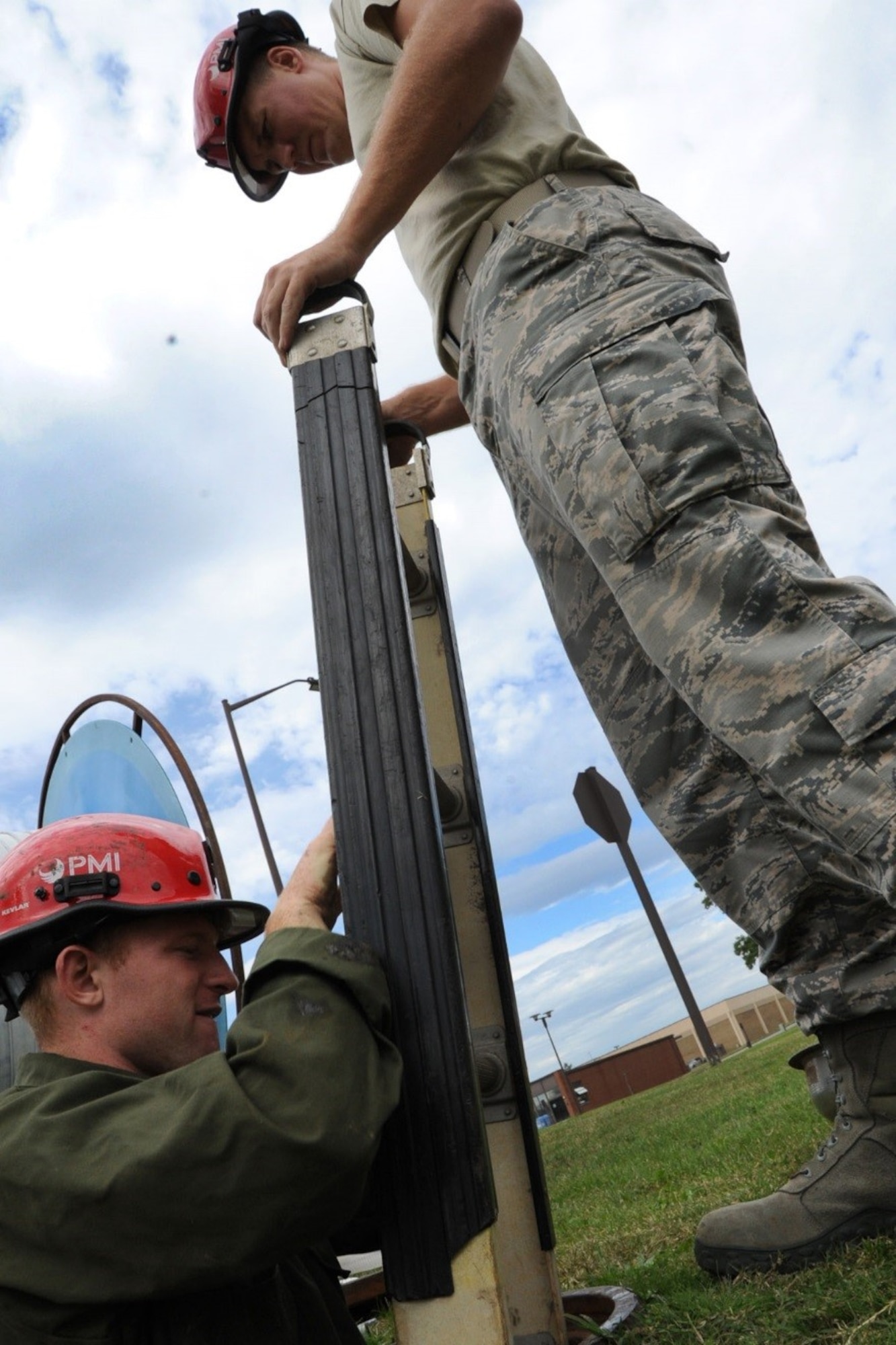 Senior Airman Cameron Porter and Airman First Class Michael Eckhoff, 744th Communications Squadron cable antenna maintenance, prepare to run 1,600 feet of fiber optic cable to the flight line on Joint Base Andrews Oct. 13, 2016. The 744th CS delivers many cyberspace operations such as secure networks, voice communications services, and communications infrastructure and intrusion detection systems within the National Capital Region.  (U.S Air Force photo/Tech. Sgt. Matt Davis)