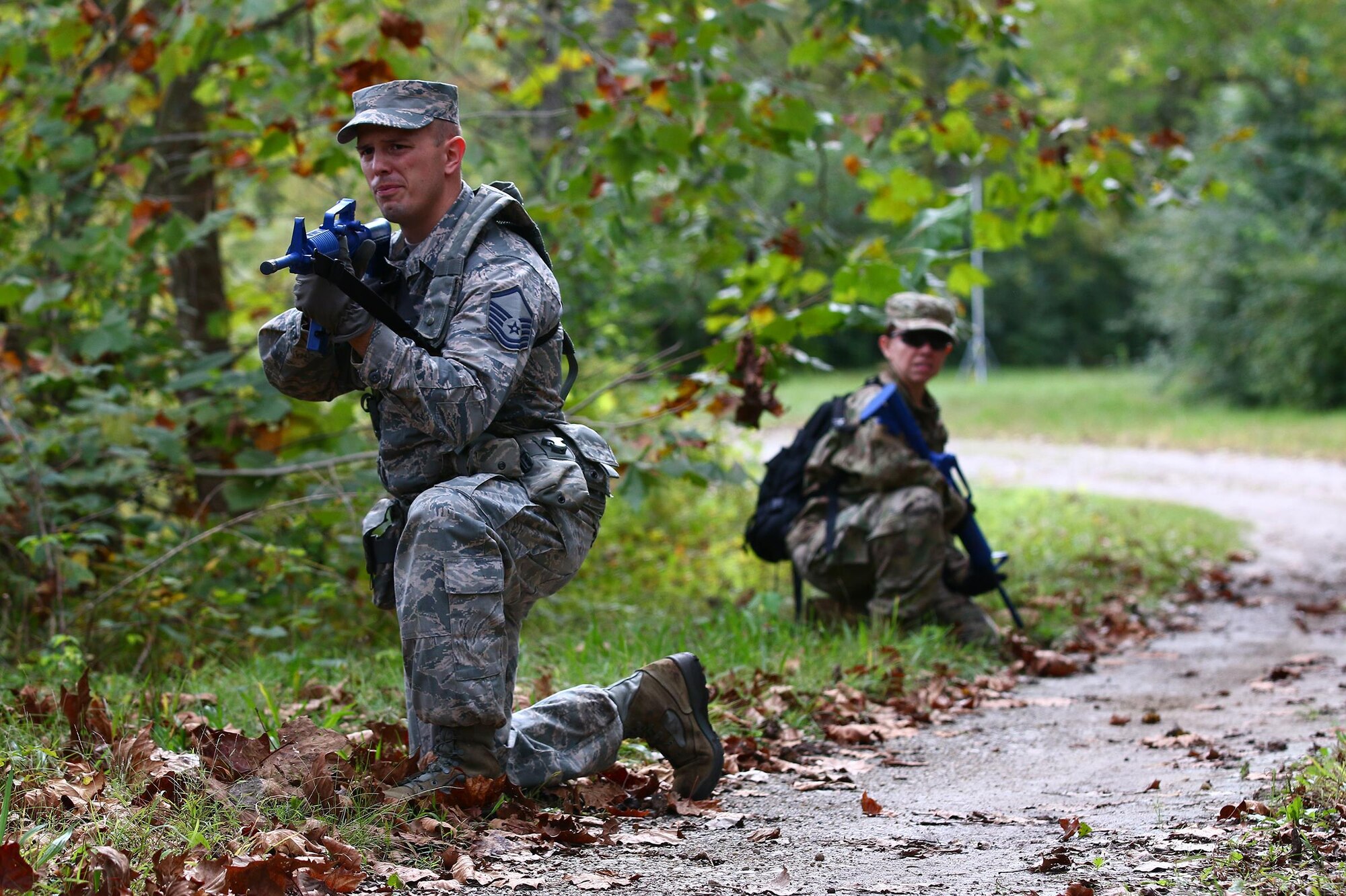 Master Sgt. Ryan LaMarr and Senior Airman Angelica Ortiz, both assigned to the 445th Security Forces Squadron, provide security as part of a land navigation training exercise held here during the Oct. 2, 2016 unit training assembly. Security forces members must accurately and effectively perform their tactical capabilities to defend against threats. (U.S. Air Force photo /Tech. Sgt. Patrick O’Reilly)