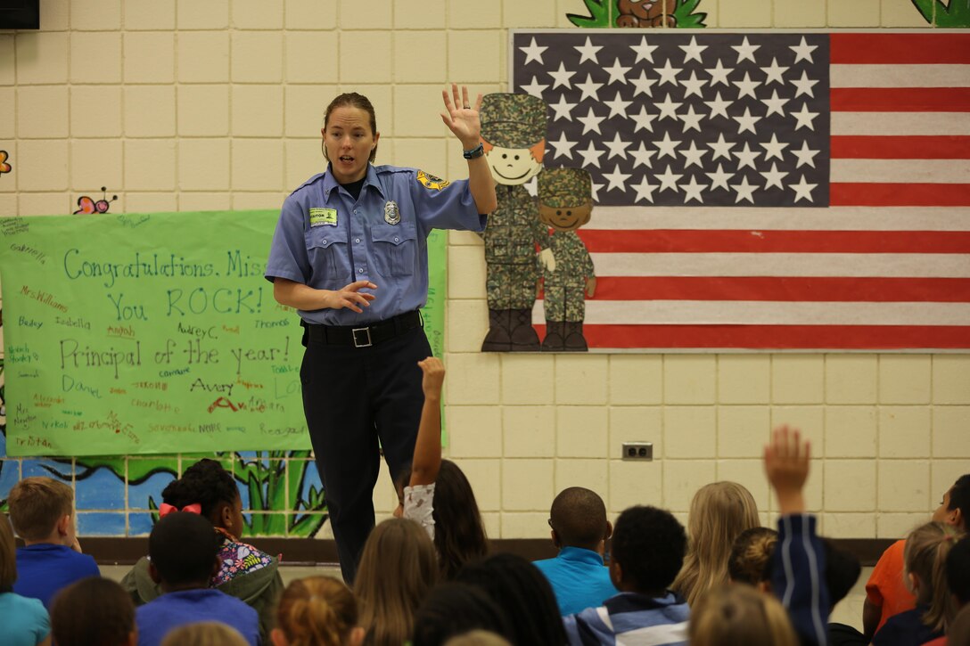 Brandee Ridgway asks students questions about fire safety at W.J. Gurganus Elementary School in Havelock, N.C., Oct. 20, 2016. The Cherry Point Fire and Emergency Services Department visited the school to demonstrate what to do in fire emergencies and how to prevent them. The students also learned about the equipment firefighters use every day to complete their mission. Ridgway is a fire inspector with the Cherry Point Fire and Emergency Services Department. (U.S. Marine Corps photo by Lance Cpl. Mackenzie Gibson/Released)