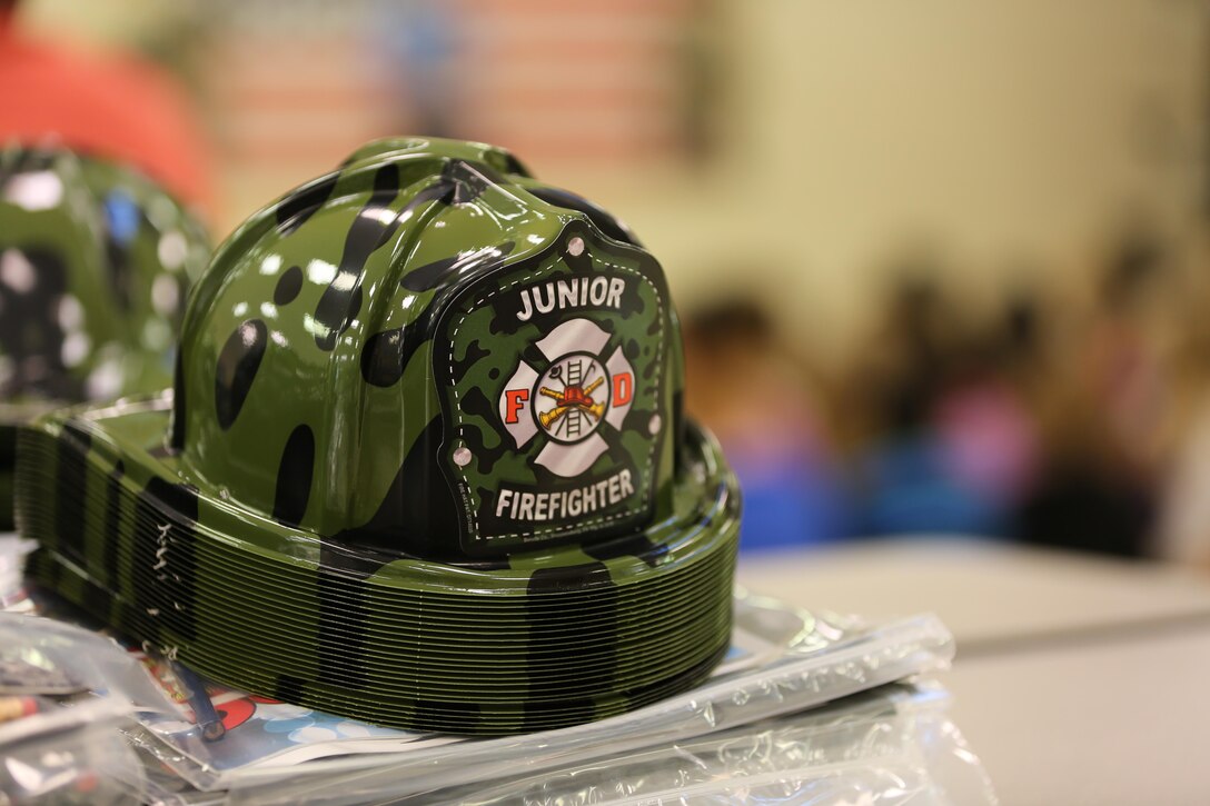 The Cherry Point Fire and Emergency Services Department visited W.J. Gurganus Elementary School in Havelock, N.C., Oct. 20, 2016, to demonstrate to students what to do in fire emergencies and how to prevent them. The students also learned about the equipment firefighters use every day to complete their mission. (U.S. Marine Corps photo by Lance Cpl. Mackenzie Gibson/Released)